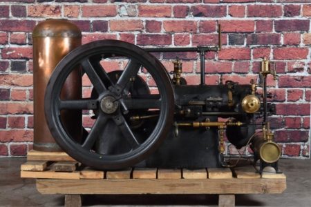 A sideview of a black gas engine